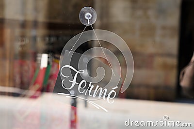 Closed french text means ferme on door store text sign board on windows shop Stock Photo