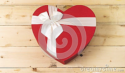 closed heart shaped box on wood table. Stock Photo