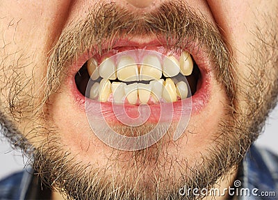 Closed human teeth grin, small gap, closeup Stock Photo