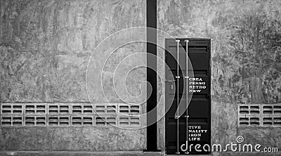 Closed iron door on concrete wall with ventilator, ,black and white scene Stock Photo