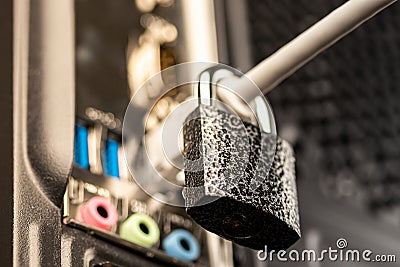 Lock hanging on a network cable Stock Photo