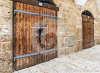 Closed and locked doors at market place in Acre Israel. Stock Photo