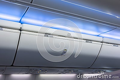 Closed luggage racks for hand luggage in an airplane Stock Photo