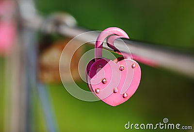 Closed pink padlock Stock Photo