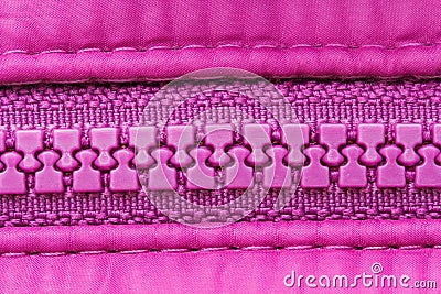 Closed pink plastic zipper closure on clothes, background Stock Photo