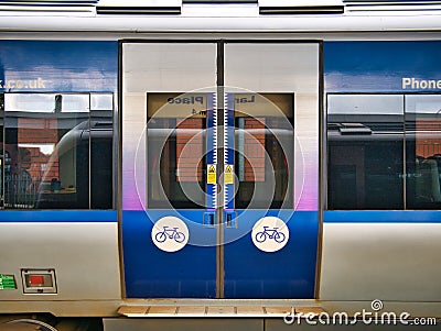 Closed railway carriage doors on a Translink train in Northern Ireland, UK. Editorial Stock Photo