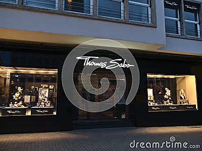 Closed shop of German jewellery and watch manufacturer Thomas Sabo during Covid-19 lockdown in evening in Christmas season. Editorial Stock Photo