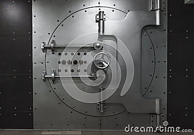 Closed steel bank vault door, close-up. Bank vault Stock Photo