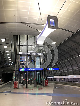 HELSINKI FINLAND - DEC 4: Helsinki-Vantaa airport train terminal empty of passengers due to travel restrictions - Editorial Stock Photo