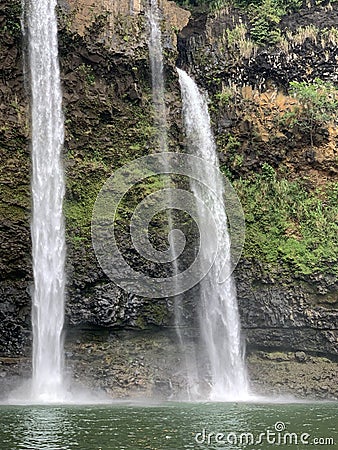 Closed up of Amazing beautiful big,giant,huge twin Wailua waterfalls on Kauai island, Hawaii. rock face in rainforest with copy Stock Photo