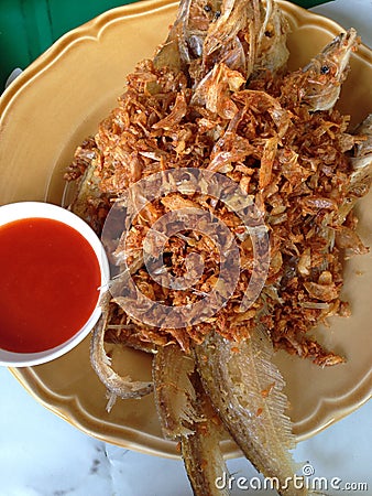 Closed up the dish of fried fish with chilli sauce Stock Photo