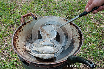 Closed up fried fish on stove, thai local life Stock Photo