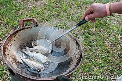 Closed up fried fish on stove, thai local life Stock Photo