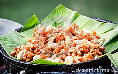 Closed up fried Thai street food style meat ball on banana leaf Stock Photo