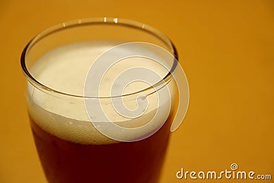 Closed Up a Glass of Dark German Lager Beer on the Table Stock Photo