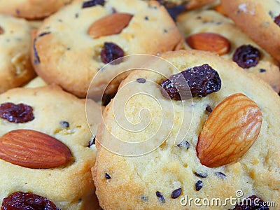 Closed up Pile of Mouthwatering Almond Raisin Butter Cookies, for Background Stock Photo