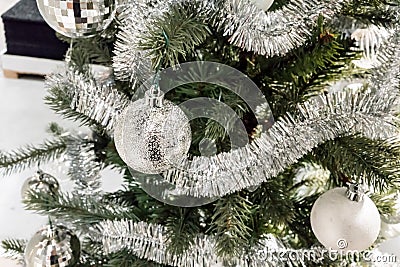 Closed up shiny silver ball on decorative Christmas tree with ti Stock Photo