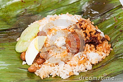 Closed up of the unwrapped original nasi lemak on banana leaf. Stock Photo