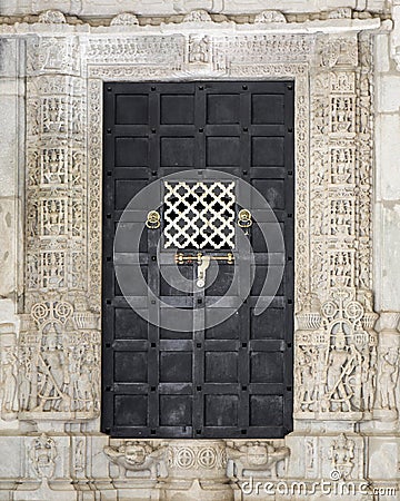 The Closed Wooden Door of An Ancient Jainism Temple Stock Photo
