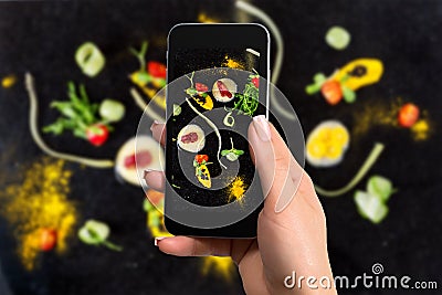 Closely image of female hands holding mobile phone with photo camera mode on the screen abstract gastronomy vanguard Stock Photo