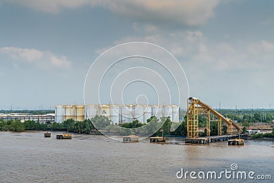 Closer look at PetroVietnam oil terminal tanks on Long Tau River, Phuoc Khanh, Vietnam Editorial Stock Photo
