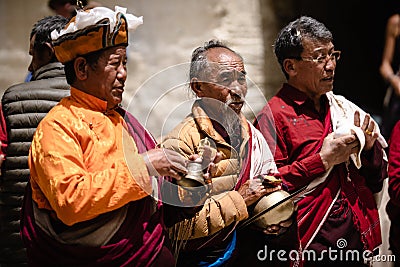 Closeup of Adult Tibetan Buddhist worshippers at the Tiji Festival in Lo Manthang, Upper Mustang Editorial Stock Photo