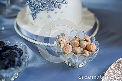 Closeup almonds in shells in glass jar Stock Photo