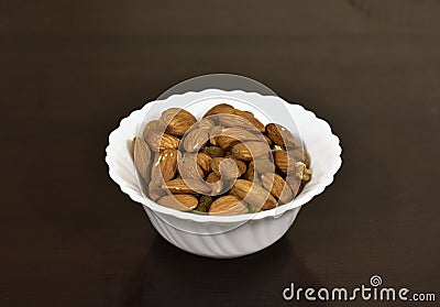 Closeup of almonds in a white bowl Stock Photo