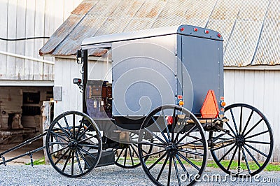Closeup of Amish Buggy in front of barn in Pennsylvania USA Editorial Stock Photo