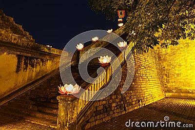 Closeup ancient architectural building with Buddhism garland flowers a night Stock Photo