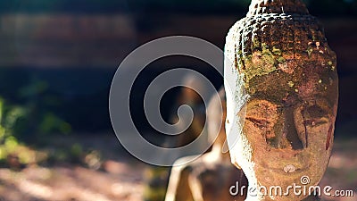 Closeup ancient head of Thai Lanna Buddha at cave temple in Chaingmai, Thailand Stock Photo