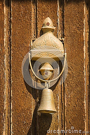 Closeup of antique bell on door Stock Photo