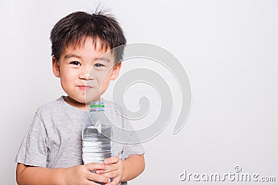 Closeup Asian face, Little children boy drinking water from Plastic bottle Stock Photo