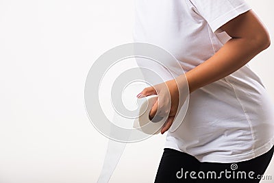 Woman diarrhea constipation holding tissue toilet paper roll on hand she crotch lower abdomen Stock Photo