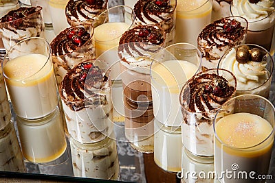 closeup assorted cream mousse dessert in plastic cups Stock Photo