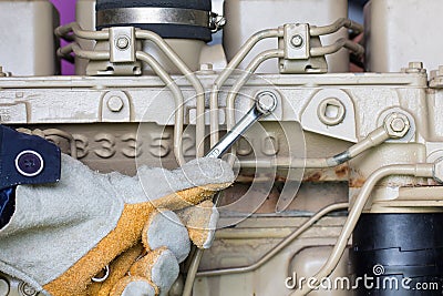 Closeup of an auto mechanic working on a Generator power Stock Photo