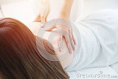 Closeup back massage pain relief in spa white clean tone Stock Photo