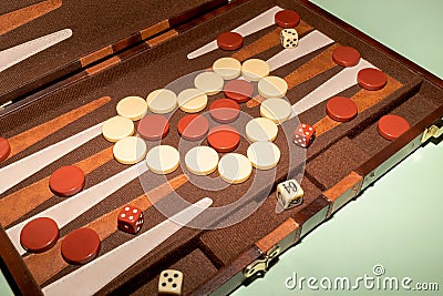 Closeup Backgammon Tables Game. Players Roll Dice, Rectangular Game Board Divided Into Two Stock Photo