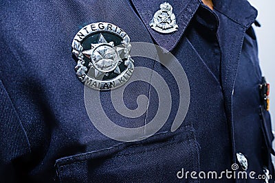 Closeup of the badge of Malaysia Police officer Editorial Stock Photo