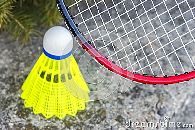 Closeup of badminton rachet and neon yellow shuttlecock, sports Stock Photo