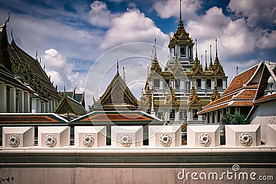 Closeup of Bangkok city with ornate shrines and a cityscape cloudy sky in the background Editorial Stock Photo
