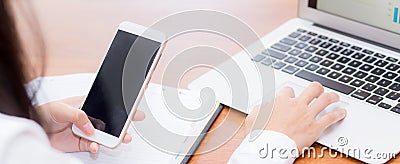 Closeup banner website asian woman sending email contact. gesture of finger pressing send on mobile smart phone and laptop Editorial Stock Photo