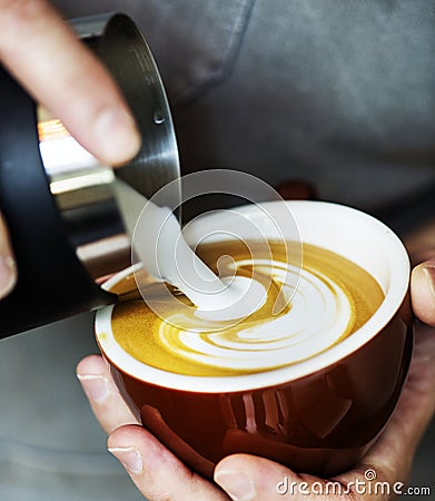 Closeup of barista making latte art Stock Photo