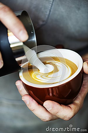 Closeup of barista making latte art coffee drink Stock Photo