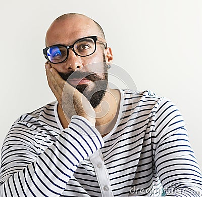 Closeup of bearded man looking bored Stock Photo