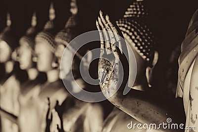 Closeup beautiful Buddha hand statue beautiful culture of Asian calm and peaceful in Thailand mono color tone photography Stock Photo