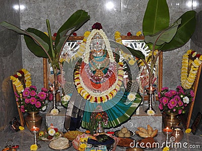 Closeup of beautiful goddess Vara Mahalakshmi decoration with flowers, fruits Editorial Stock Photo