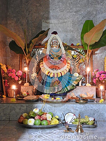 Closeup of beautiful goddess Vara Mahalakshmi decoration with flowers, fruits Editorial Stock Photo