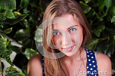 Closeup of beautiful smiling girl with long blond hair Stock Photo