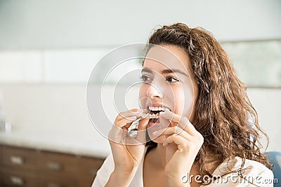 Woman Wearing Clear Aligner In Dental Clinic Stock Photo